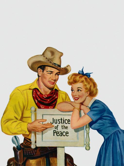 Couple posing in front of "Justice of the Peace" sign